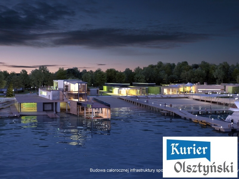Nowoczesna plaża miejska z infrastrukturą i jeziorem w tle, widok o zmierzchu.