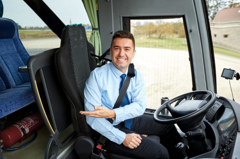 happy driver inviting on board of intercity bus