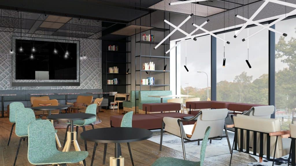 Wnętrze nowego hotelu z dużymi oknami, nowoczesnym wystrojem i strefą wypoczynkową.