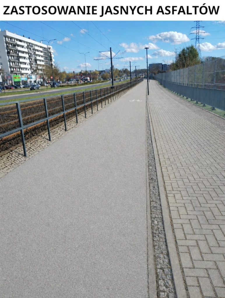 Nowa ścieżka rowerowa w Olsztynie, oddzielona od tor&oacute;w i chodnika, w słoneczny dzień.